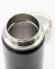A Firefly Meadow 18 oz Steel Bottle with a lid on a white background by Cognitive Surplus.