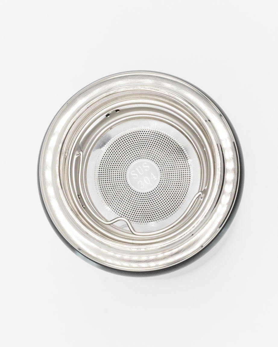 An Infuser Basket for Stainless Steel Bottles with a lid on a white surface by Cognitive Surplus.
