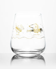 A Space Telescopes Wine Glass with a gold design on it by Cognitive Surplus.